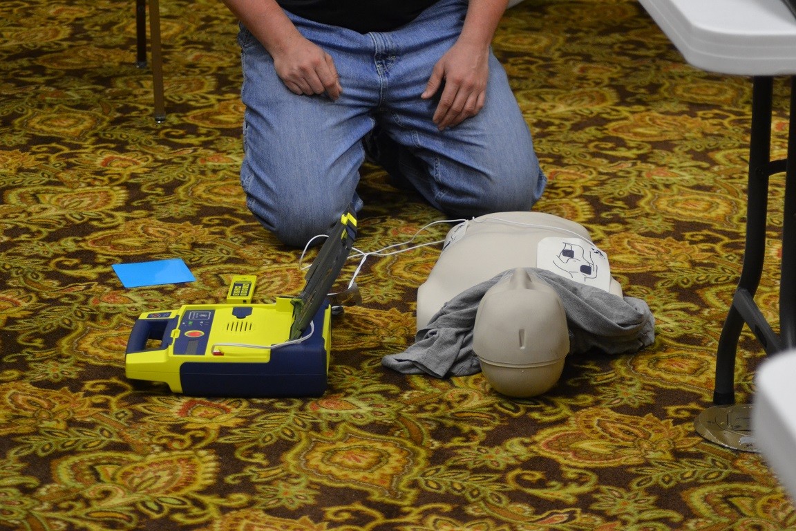 dummy doll laying on the floor
