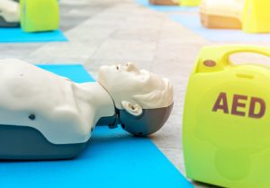 dummy doll laying on blue carpet
